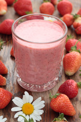 Two glasses of freshly prepared, delicious strawberry milkshake.