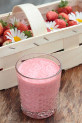 Two glasses of freshly prepared, delicious strawberry milkshake.