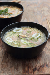 Bowl of oriental noodle and seafood soup.