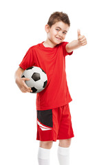 standing young soccer player holding football - 84301710