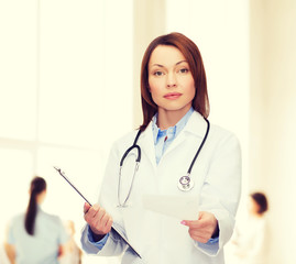 calm female doctor with clipboard