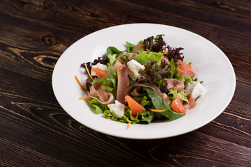 Vegetable salad with grapefruit.