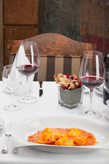  Delicious ravioli medallions with marinara sauce in restaurant