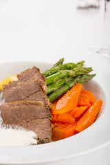 Delicious veal in white sauce in restaurant