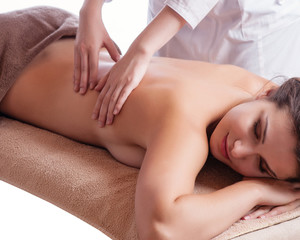 Beautiful young woman getting spa massage