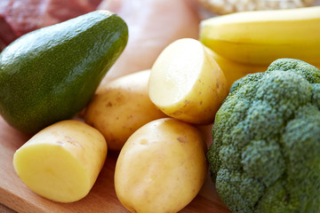 close up of potatoes, broccoli and avocado