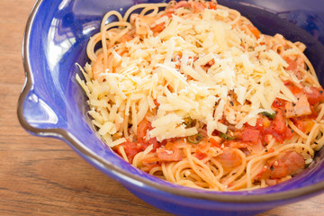 Italian pasta with ham, tomato and champignon mushrooms