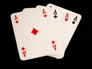 Four aces on black background