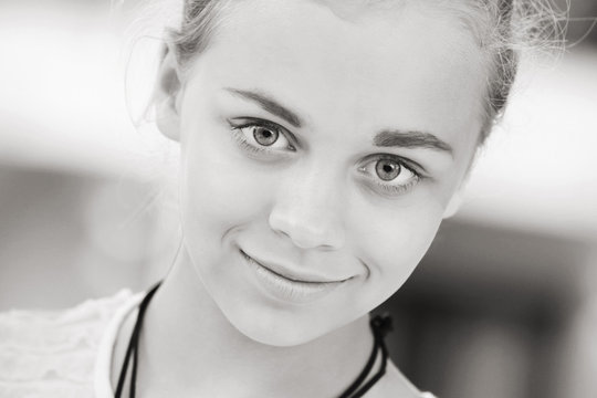 Blond beautiful girl teenager closeup portrait