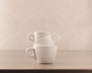 Fototapeta na wymiar Empty coffee cups on wooden table