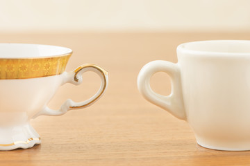 Empty coffee cups on wooden table