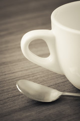 Empty coffee cup on wooden table