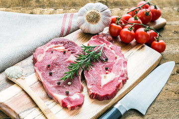 Raw fresh meat Ribeye steak entrecote on wooden background