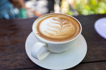 art latte coffee on white cup
