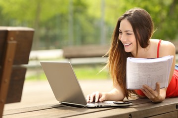 Student learning with a laptop in an university campus