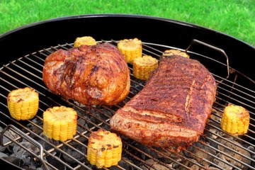 Barbecue Pork Eisbein And Spareribs on The Flaming Charcoal Gril