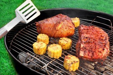 Spatula, BBQ Pork Knuckle and  Spareribs On The Flaming Grill