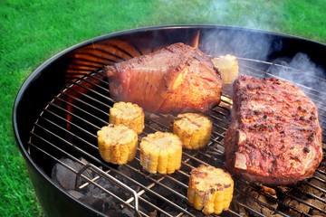 Barbecue Eisbein And Spareribs on The Flaming Charcoal Grill