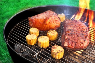 BBQ Pork Knuckle And Spareribs on The Flaming Charcoal Grill