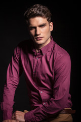 Fototapeta premium handsome young man posing on dark background.