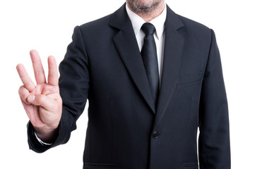 Business man showing number three with fingers