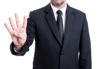 Business man showing number four with fingers