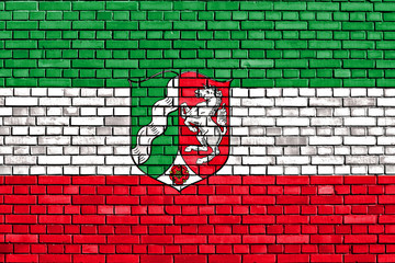 flag of North Rhine-Westphalia painted on brick wall
