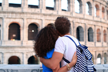 Naklejka premium Couple of tourist in Rome near the Colosseum