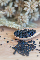 Roasted Sesame on wood spoon.