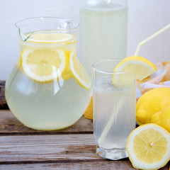 Obraz na płótnie Canvas Glass of homemade lemonade on a wooden table 