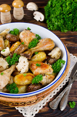 Baked chicken legs with potatoes, champignon and cauliflower