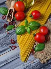 Italian food pasta, tomato, basil, olive oil, pepper