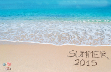 summer 2015 written on a tropical beach