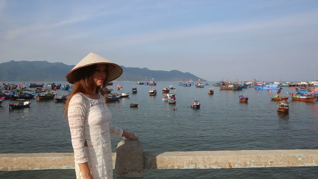 blonde girl in vietnamese has nice time in fishing village	