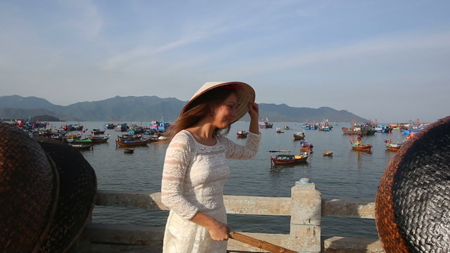 blonde girl in vietnamese has nice time in fishing village	