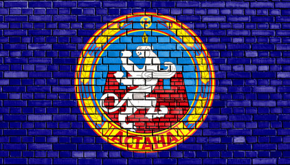 flag of Astana painted on brick wall