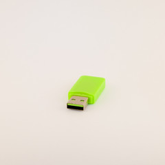 Green USB memory stick isolated on white