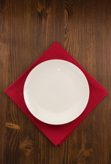 plate, knife and fork  on wood