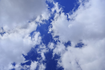 Grey clouds in blue sky