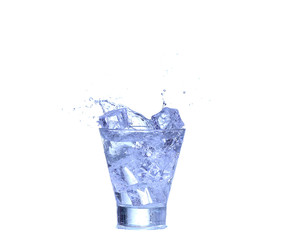 Glass of water, ice and slice of fresh lemon on a white background