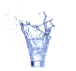 Glass of water, ice and slice of fresh lemon on a white background
