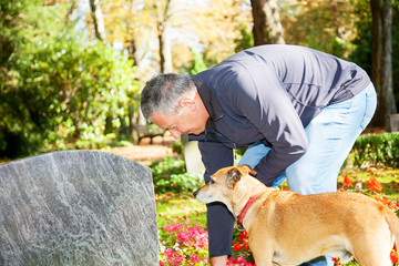 Man and dog in the cemetery