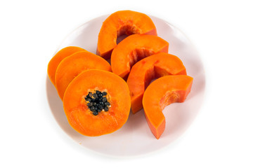 Isolated ripe papaya in the white dish