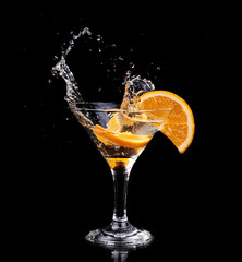 Vermouth cocktail inside martini glass over dark background