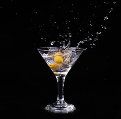 Vermouth cocktail inside martini glass over dark background