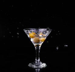 Vermouth cocktail inside martini glass over dark background