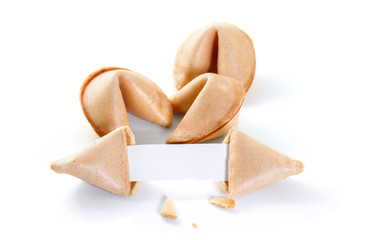 Chinese fortune cookie with blank paper strip isolated on white