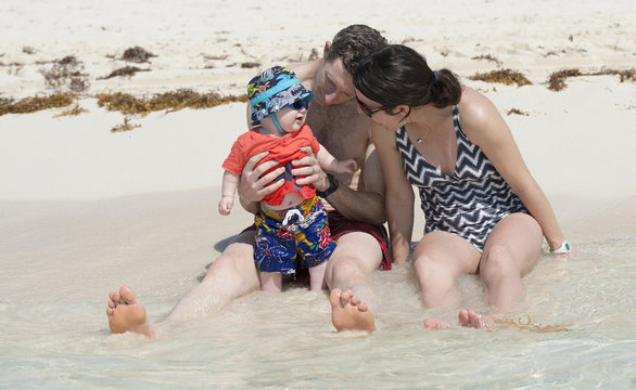 A Family On The Beach In Cancun, Mexico