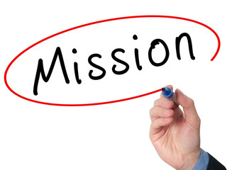 Hand writing Mission with marker on virtual screen.