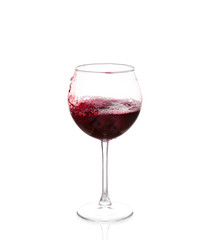Red wine pouring on white background
